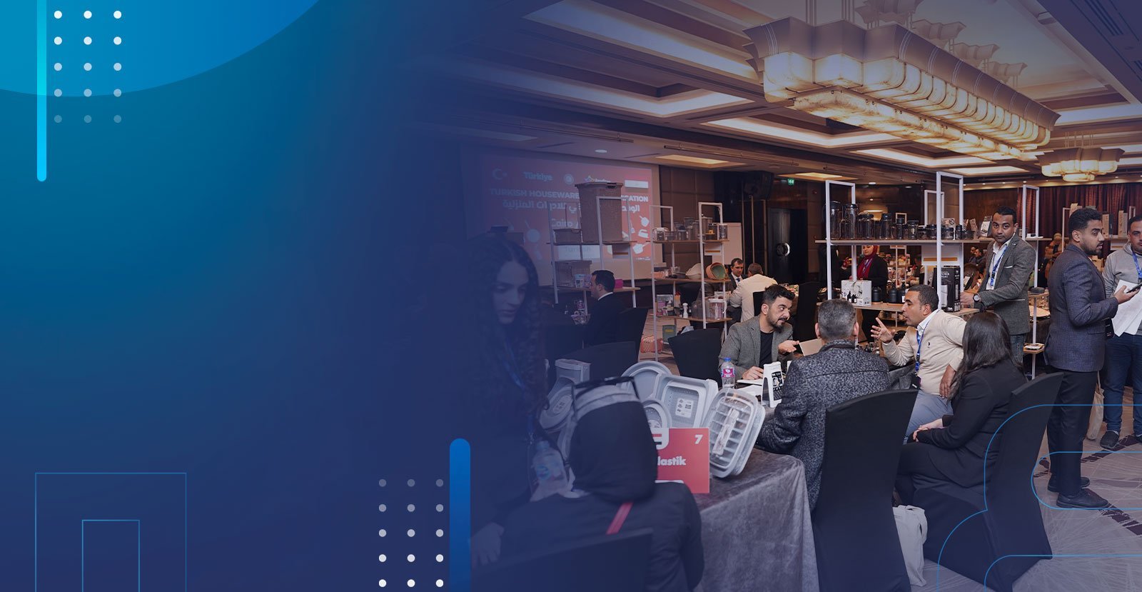 Trade event participants meeting around exhibition tables